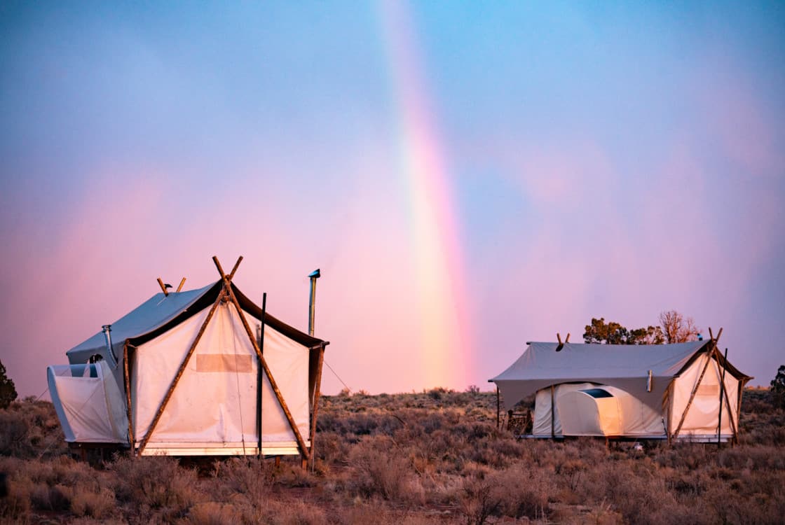 Under Canvas glamping tents at dusk at the Grand Canyon location in Grand Canyon Junction, AZ.