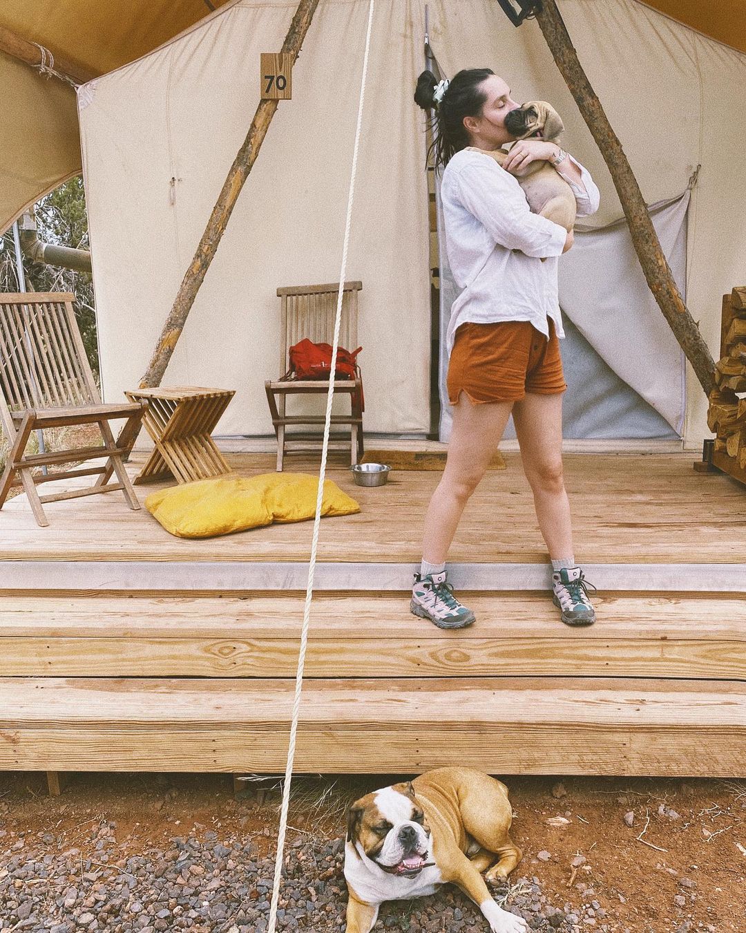 Pia Baroncini with puppy on deck of tent at Under Canvas Grand Canyon