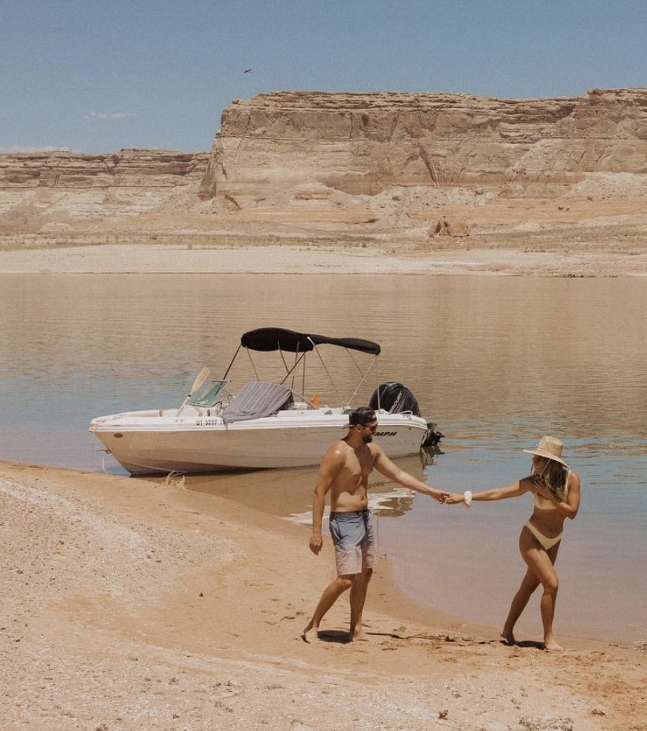 Dan and Chelle at Lake Powell with boat on Lone Rock Beach