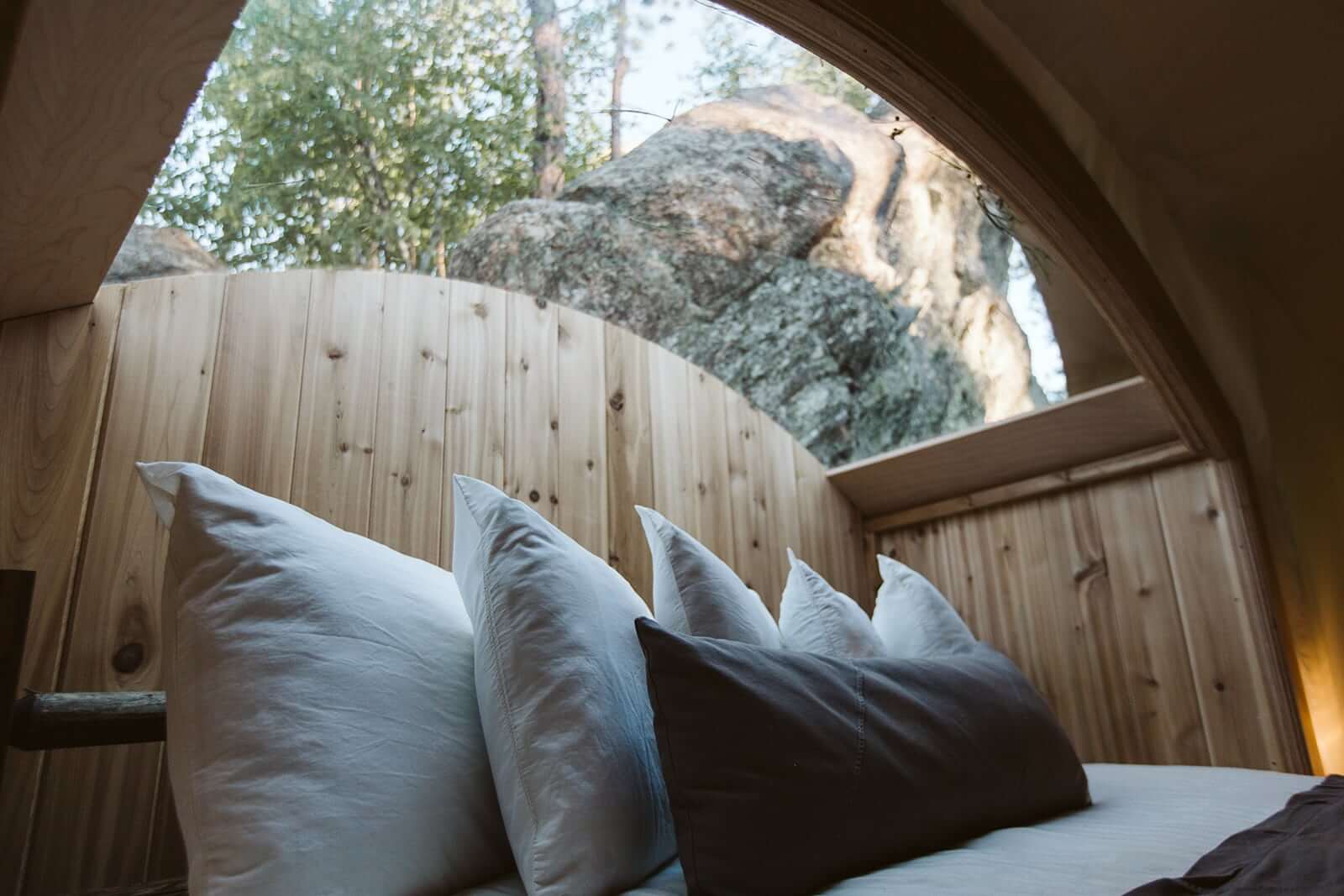 Close Up of Pillows on Bed in Under Canvas Stargazer Tent