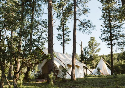 Luxury Glamping Tent with Hive Surrounded by Trees at Under Canvas Rushmore