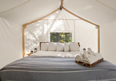 View of Bed in Suite Tent Under Canvas Glacier