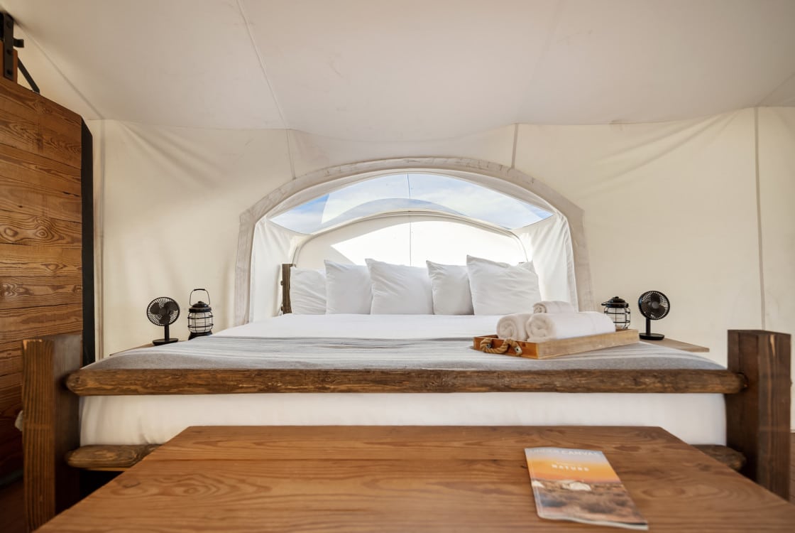 View of Bed in Stargazer Tent at Under Canvas Grand Canyon