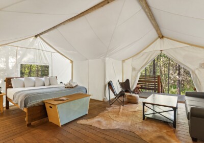 View of Bed in Suite Tent at Under Canvas Glacier