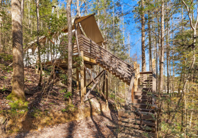 Deluxe tent on hillside at Under Canvas Great Smoky Mountains