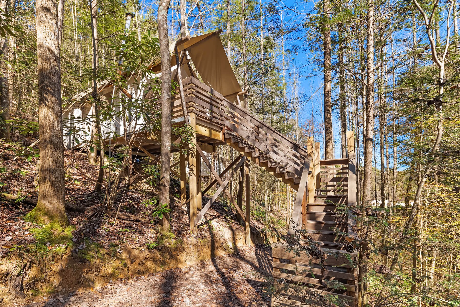 Deluxe tent on hillside at Under Canvas Great Smoky Mountains