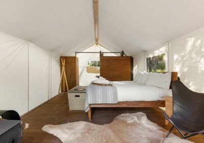 View of Bed in Deluxe Tent Under Canvas Glacier