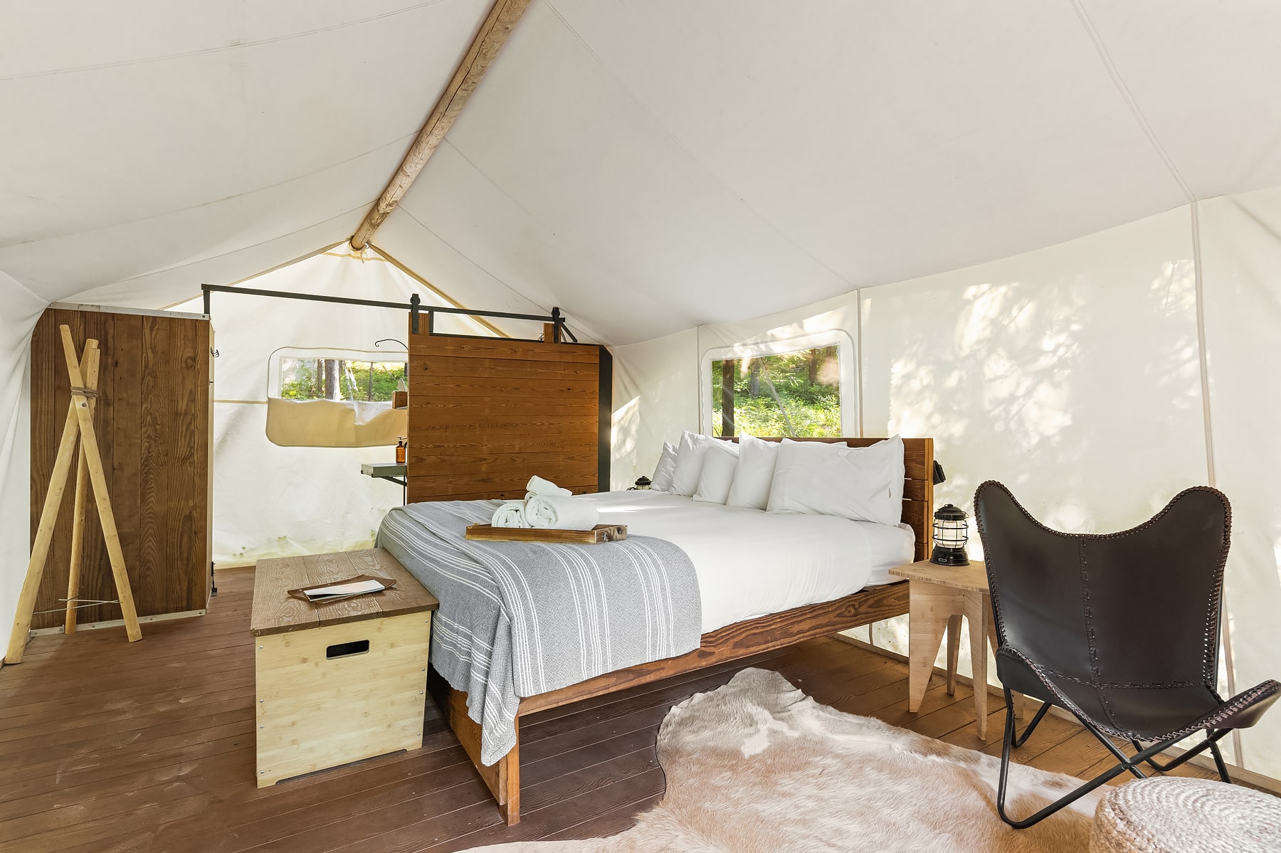 View of Bed in a Deluxe Tent Under Canvas Glacier