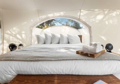 View of Bed in Stargazer Tent at Under Canvas Bryce Canyon