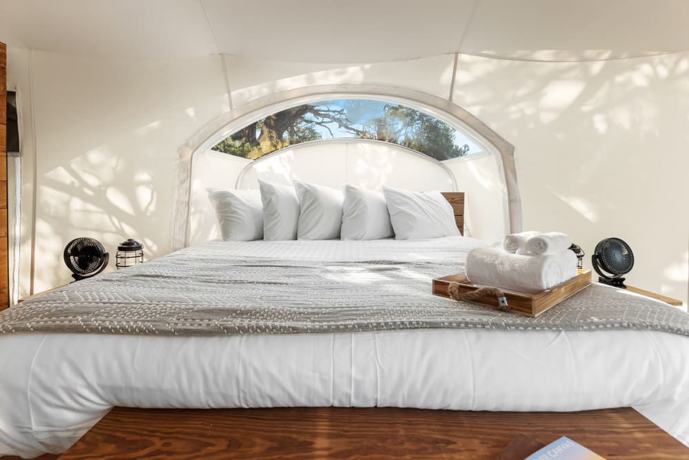 View of Bed in Stargazer Tent at Under Canvas Bryce Canyon