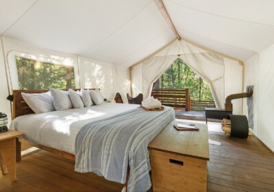 View of Bed in Deluxe Tent Under Canvas Glacier