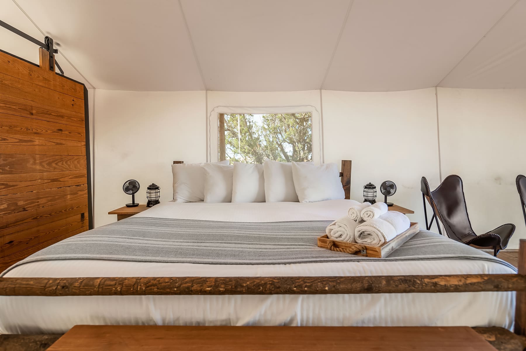 View of Bed in a Deluxe Tent at Under Canvas Grand Canyon