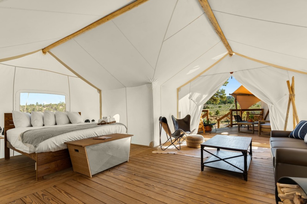 Hoodoo Suite Interior with view of deck and adjoining tent at Under Canvas Bryce Canyon