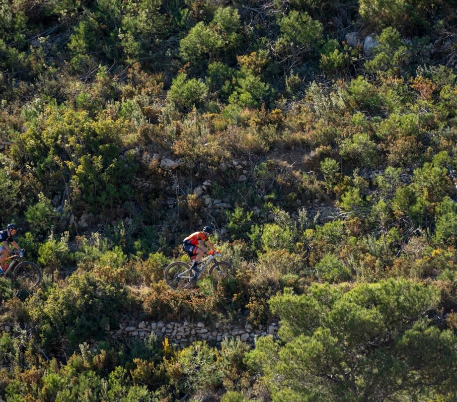 Two people mountain biking near Under Canvas Santa Fe.