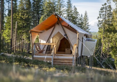 canvas tent with private deck surrounded by trees