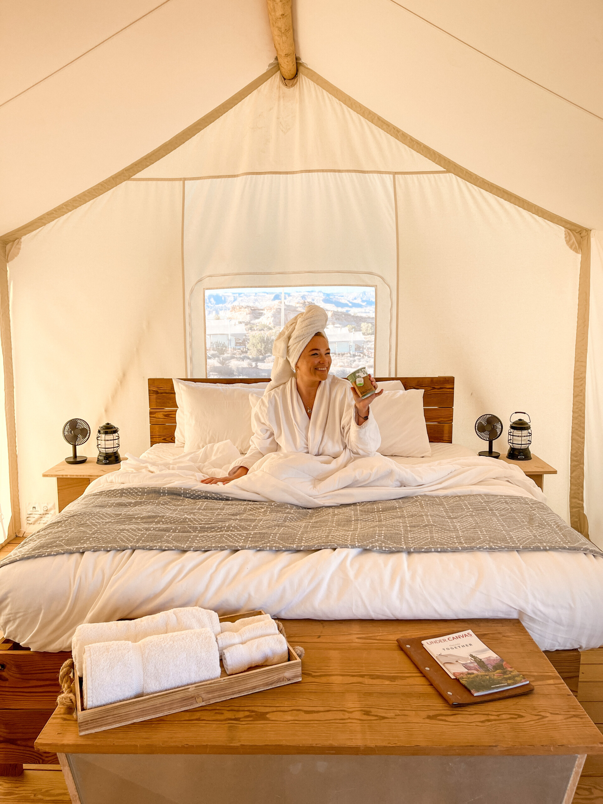Alix Traeger in bed of Suite Tent at Under Canvas Lake Powell-Grand Staircase
