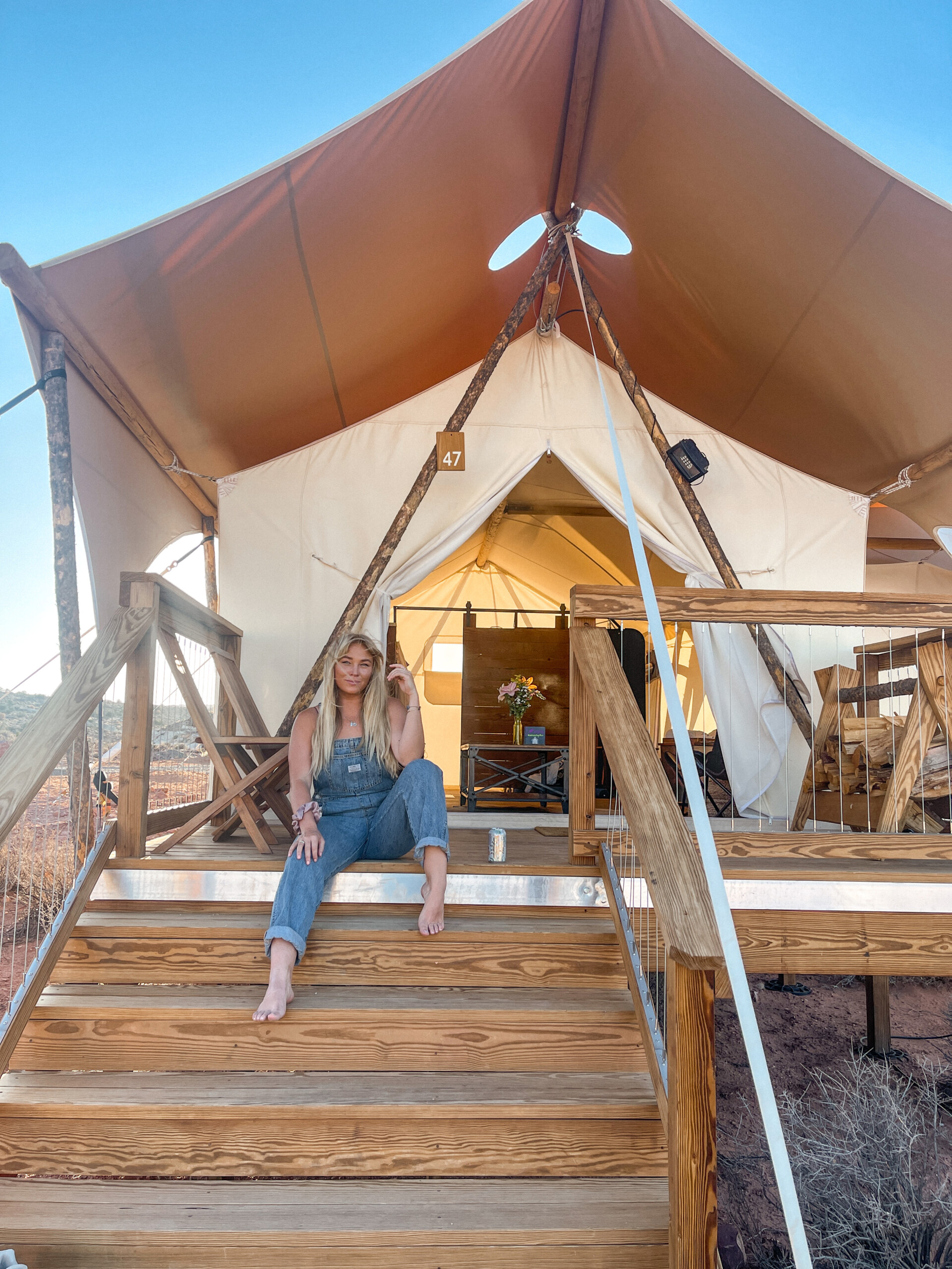 Alix Traeger on deck of tent at Under Canvas Lake Powell - Grand Staircase