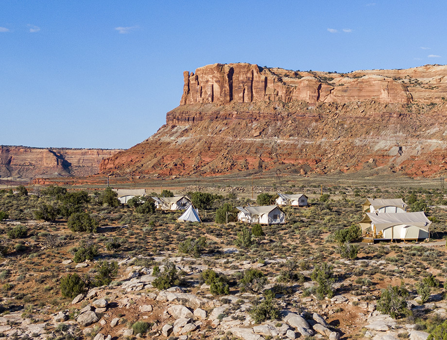 Under Canvas Moab tents with red rock butte