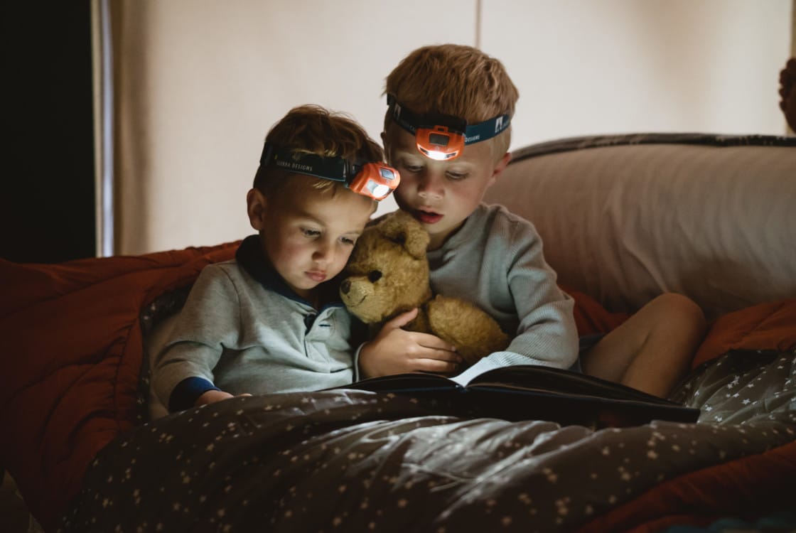 Children reading before bed
