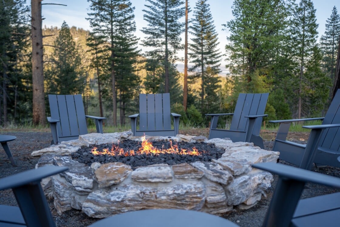 Adirondacks around a fire pit at Under Canvas Yosemite.
