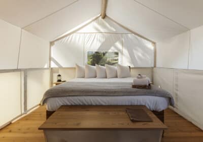 king bed in canvas tent