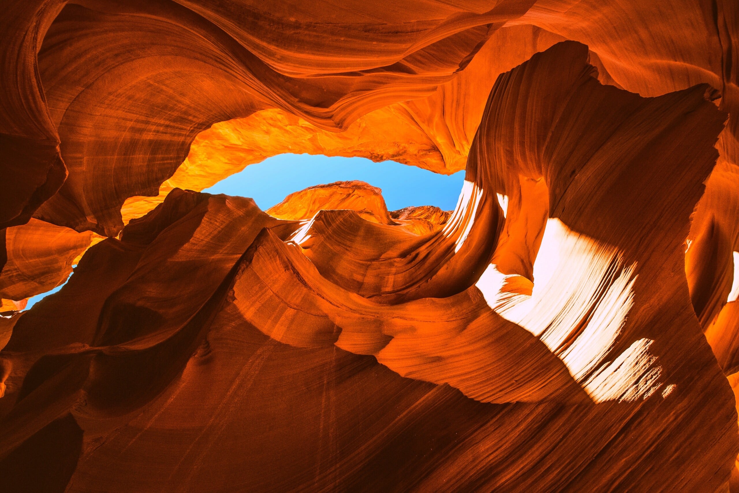 Woman staring up at sky in Antelope Canyon