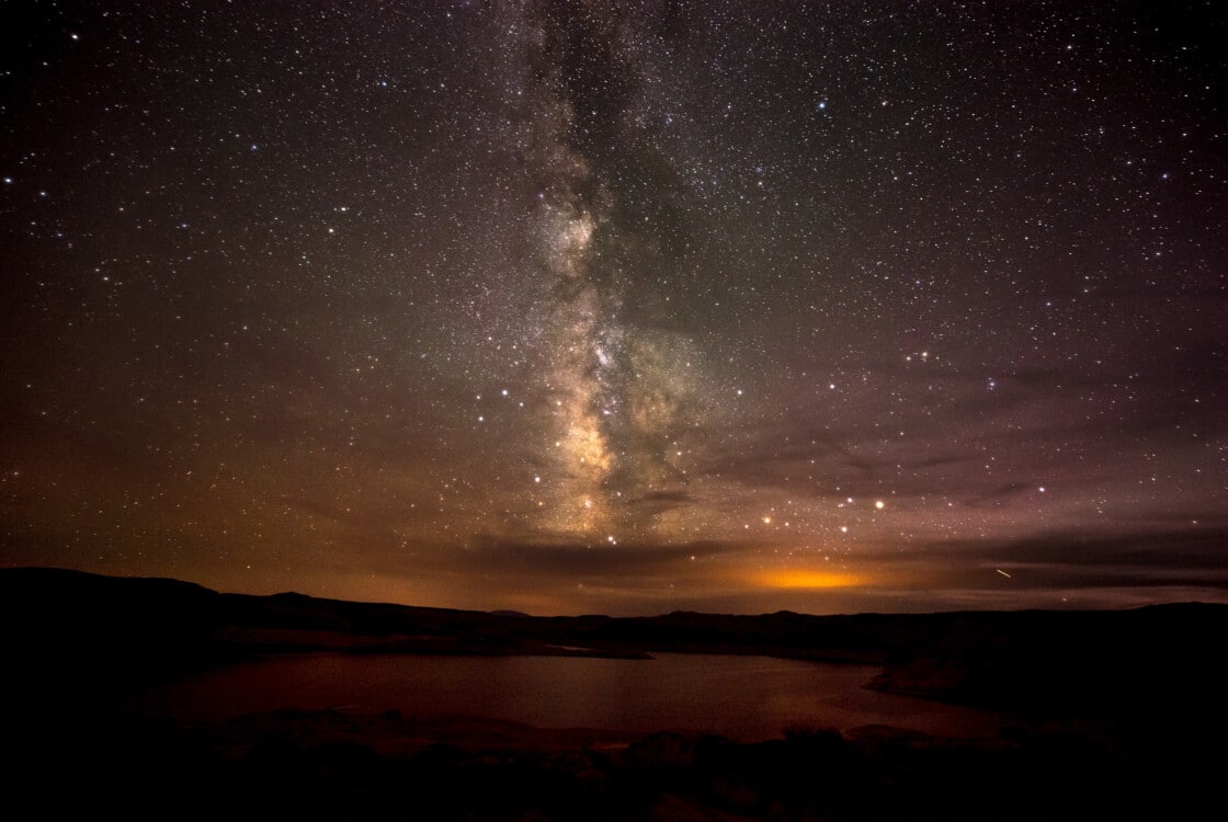 A dark and starry night sky with the Milky Way visible.