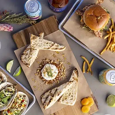 Overview of a food platter showing culinary offerings at Under Canvas resorts.