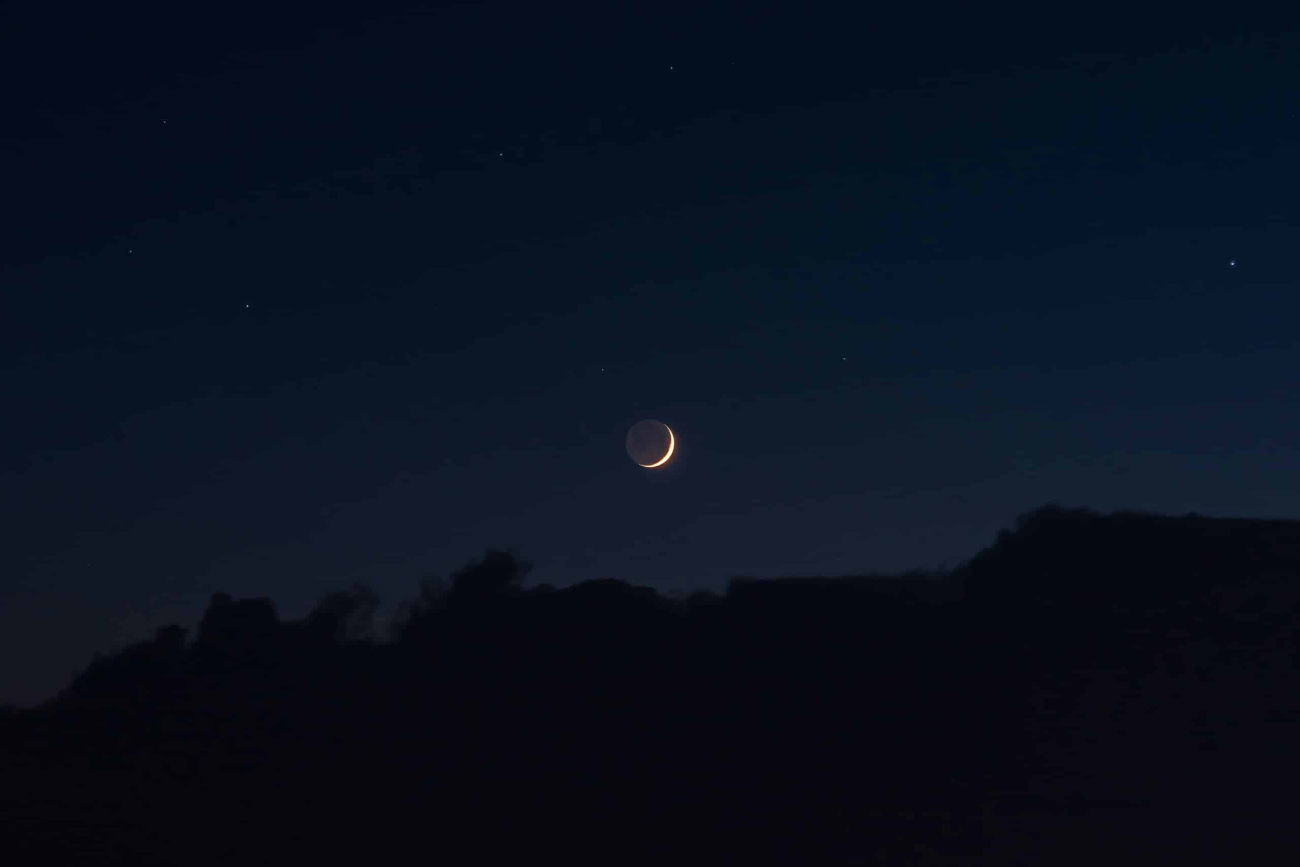 New Moon Behind Mountain