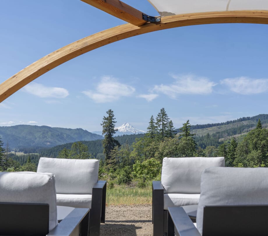 Outdoor lounge seating area with views of Mount Hood at Under Canvas Columbia River Gorge