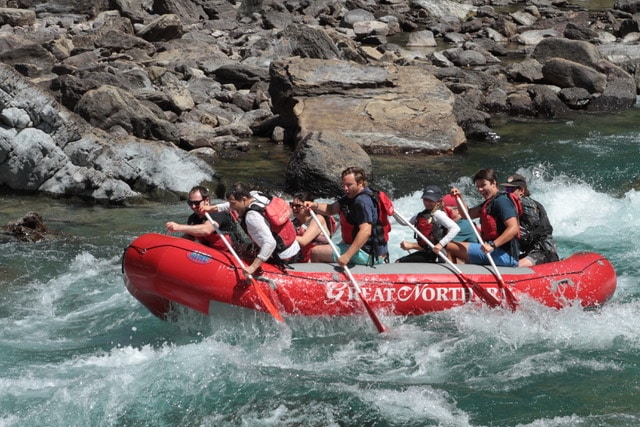 Rafters going through a rapid near Glacier National Park.