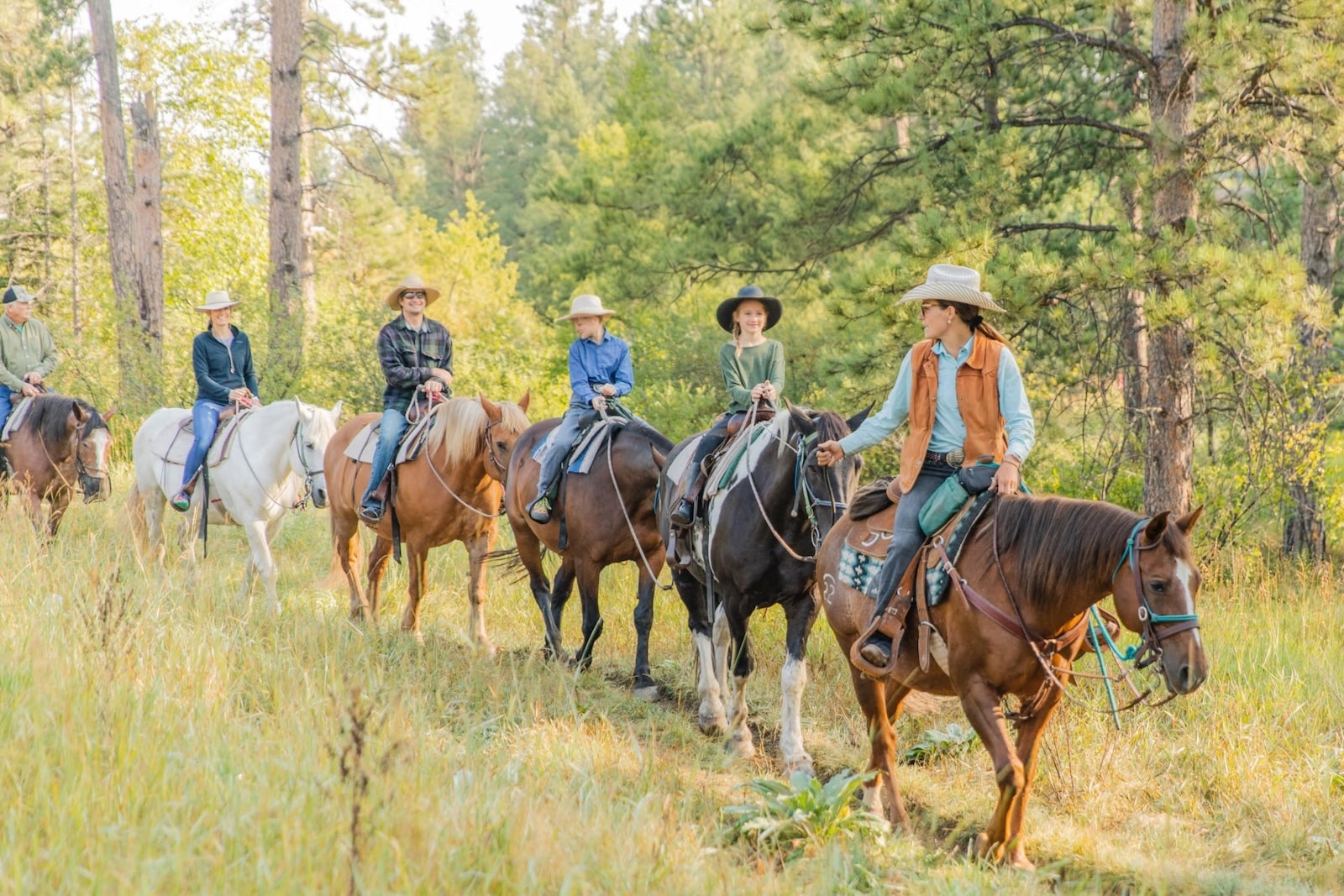 Group of horseback riders in the Black Hills of SD.