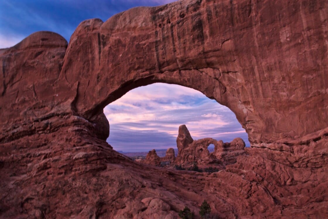 Looking through an arch towards another arch at arches national park.