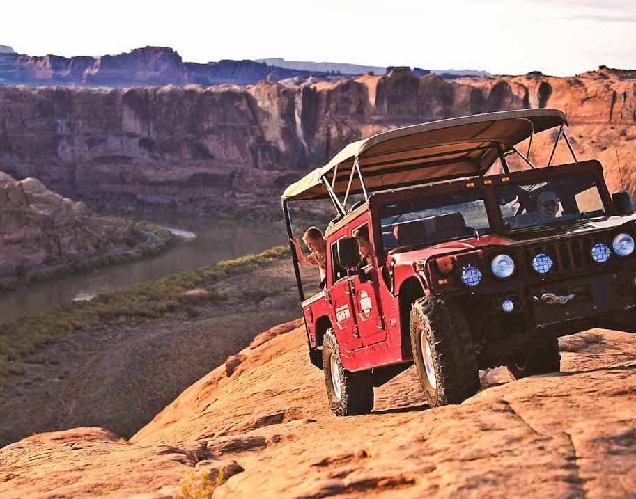 Hummer tour near Moab, close to a cliffs edge.