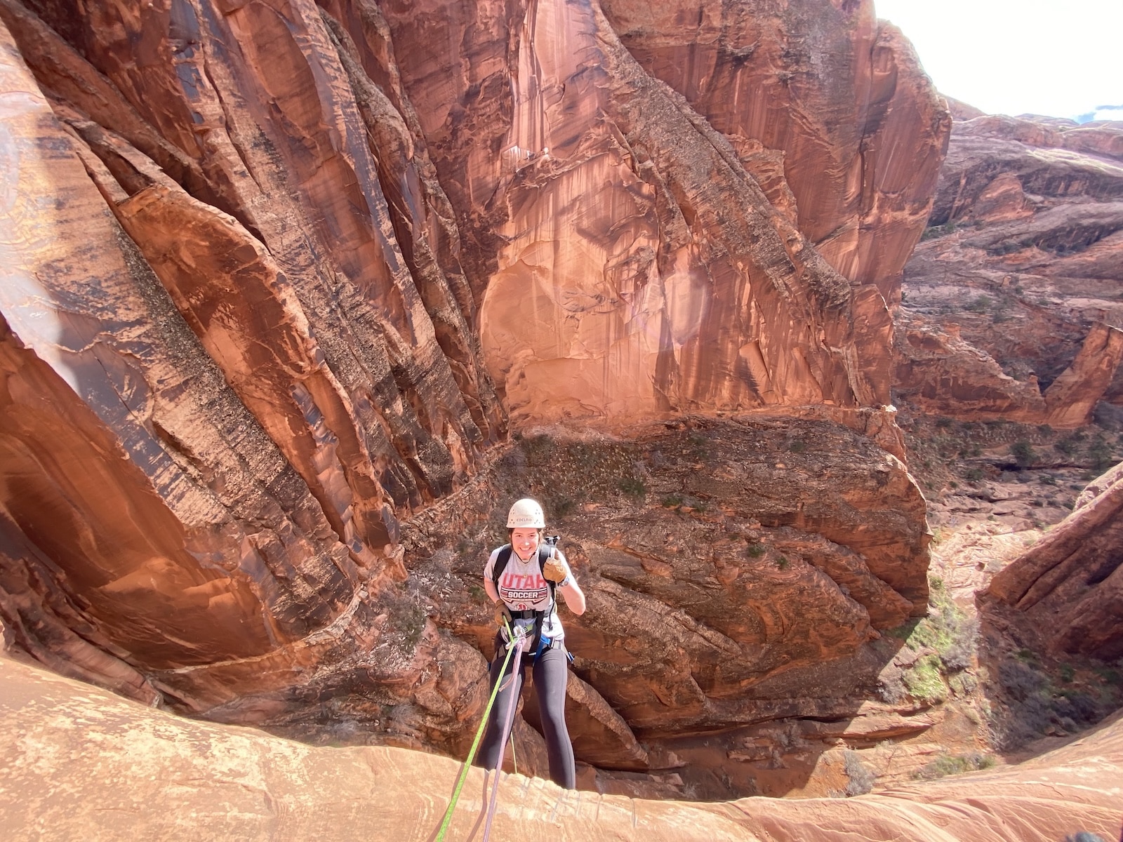 Woman repelling down Zig Zag Canyon.