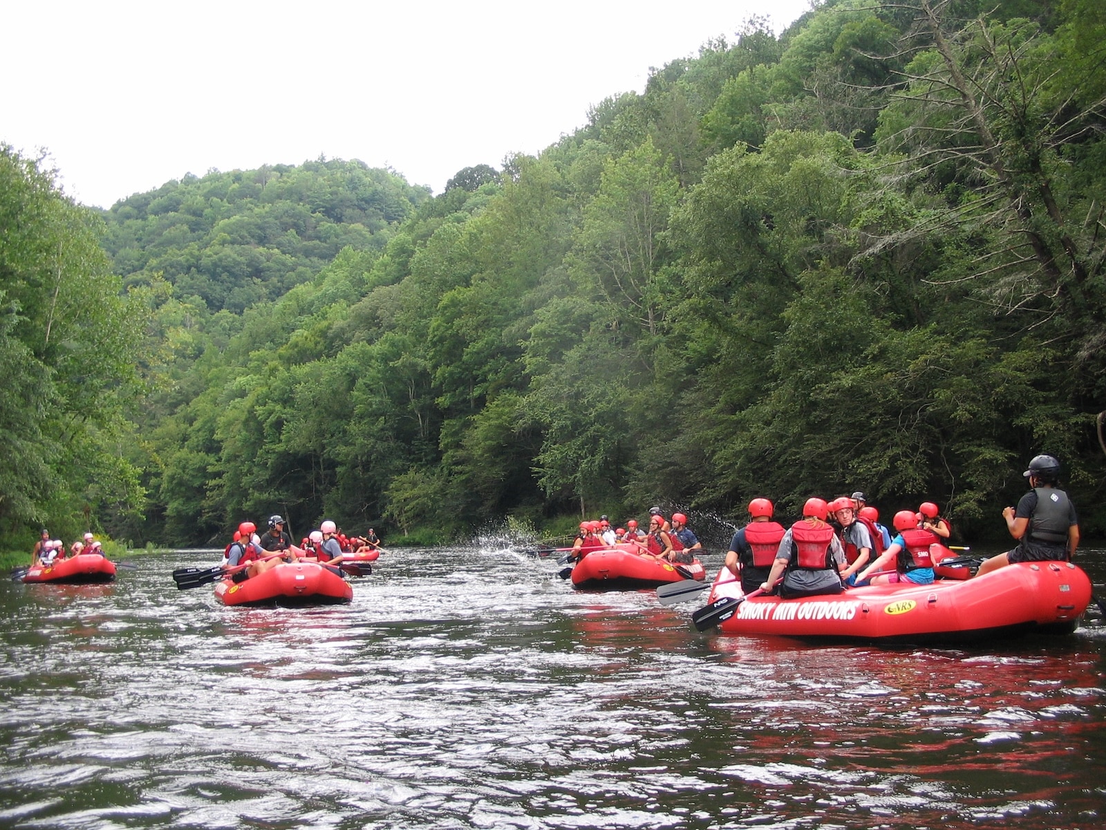 Group of rafters on the lower Pigeon River near Gatlinburg TN.