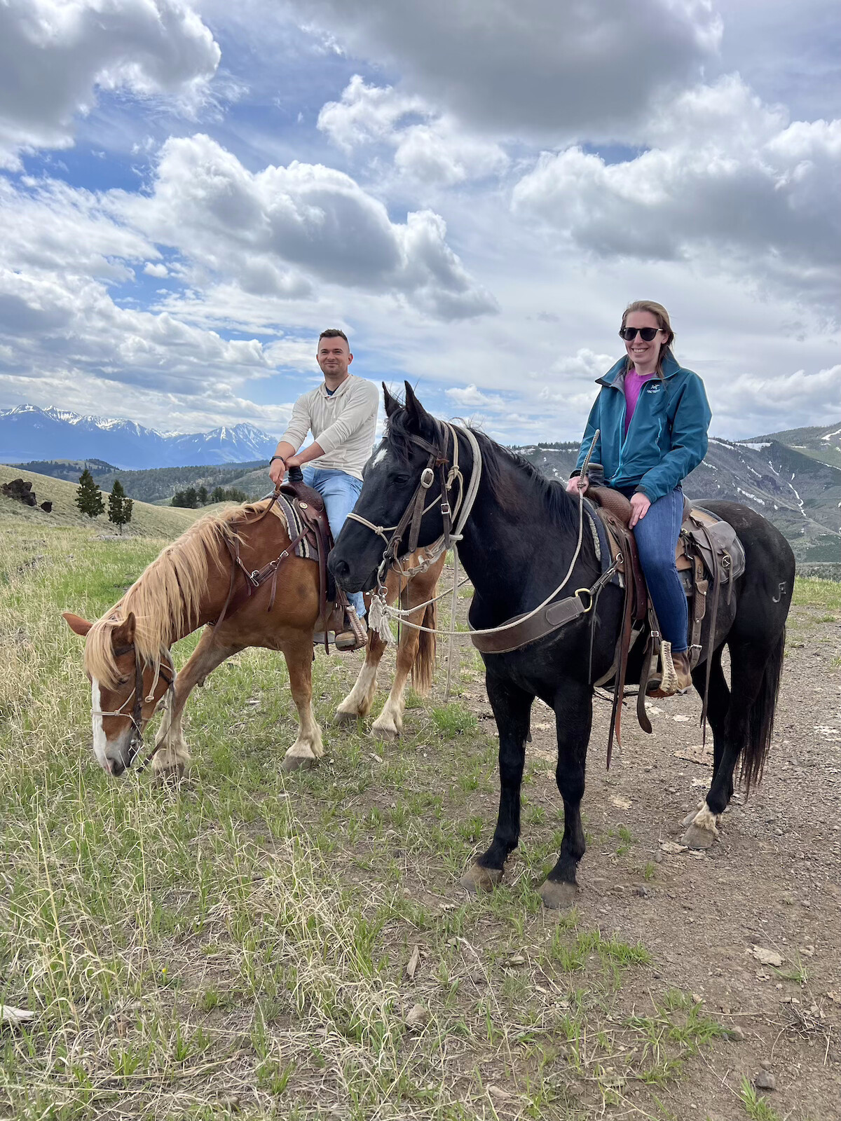 Two people on horseback in Yellowstone National Park.