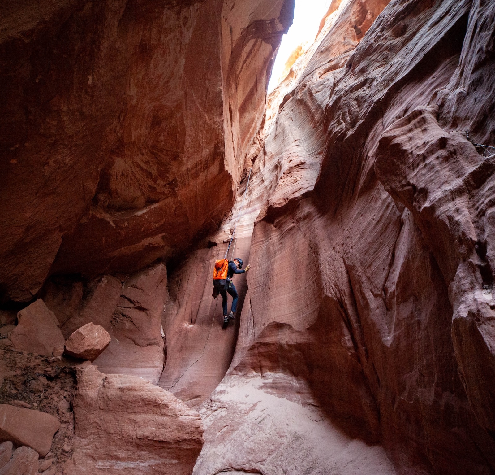 Man repelling down Loki Canyon near Lake Powell.
