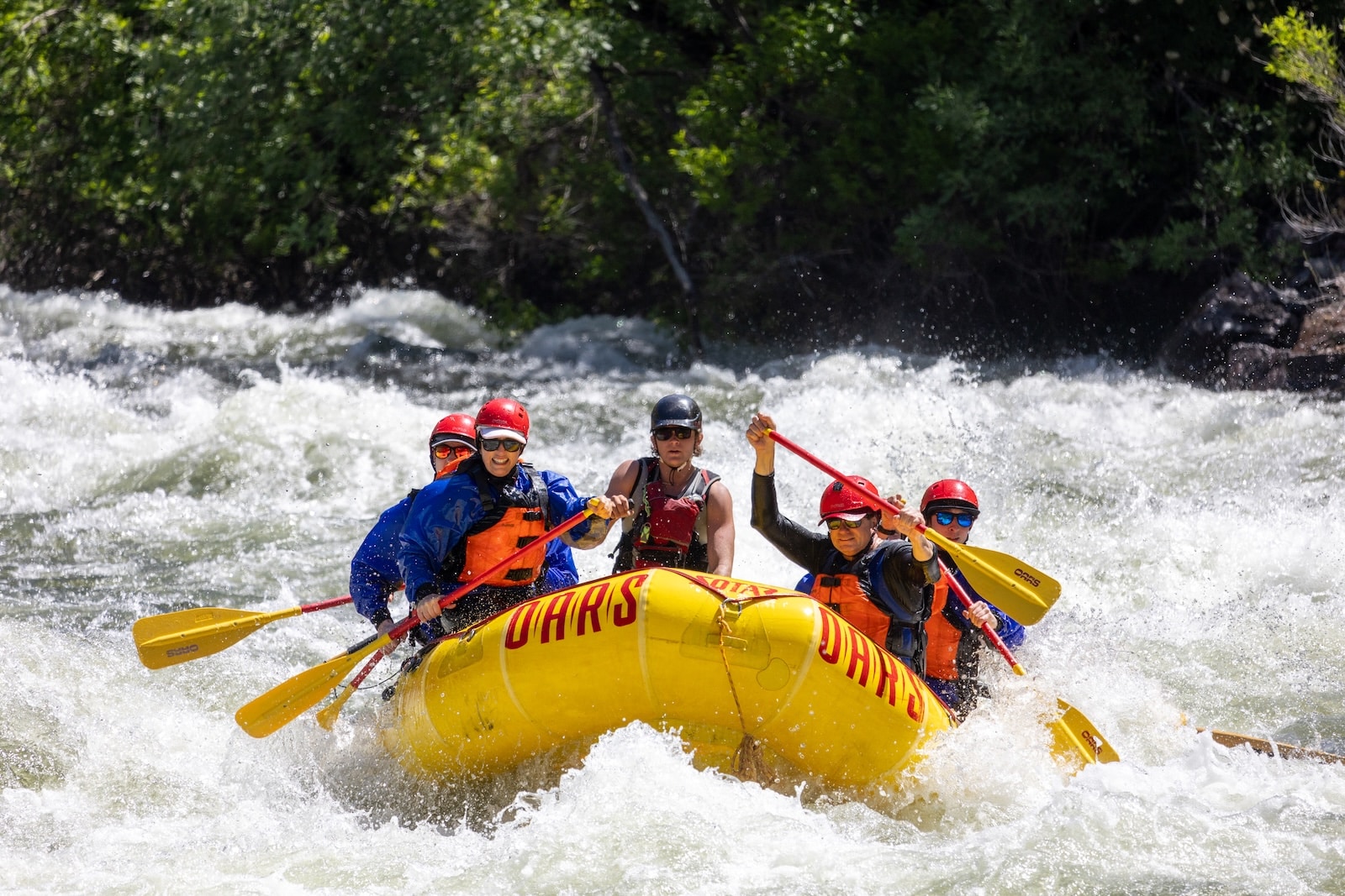 Peopl whitewater rafting the Merced River.