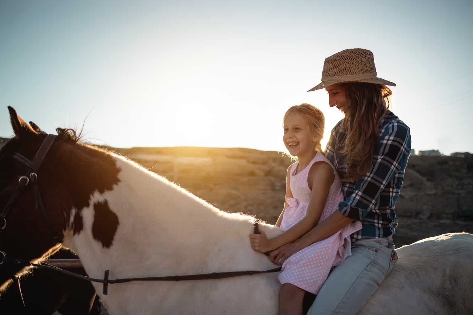 Mom and daughter on horseback in Yellowstone.