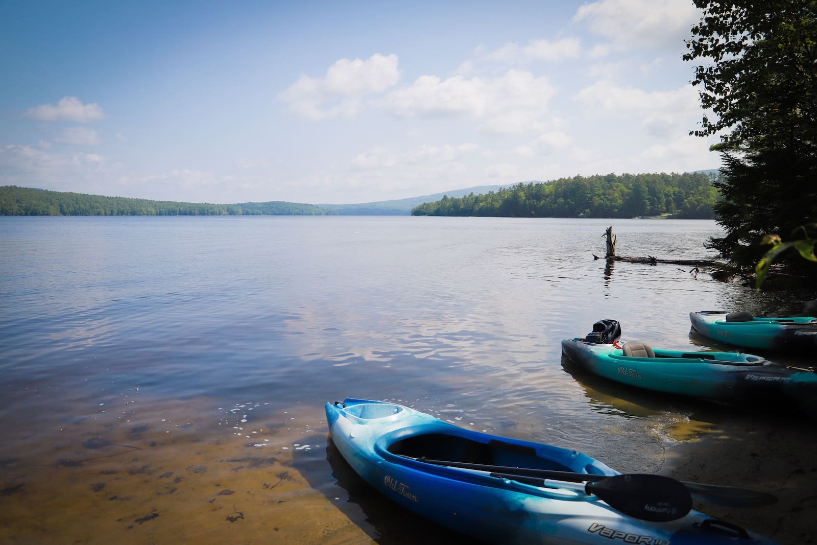 Kayaks on the shore of Moore Reservoir in New Hampshire.