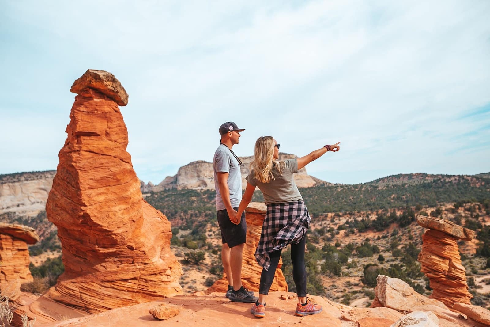 Couple overlooking hoodoos in Bryce Canyon.