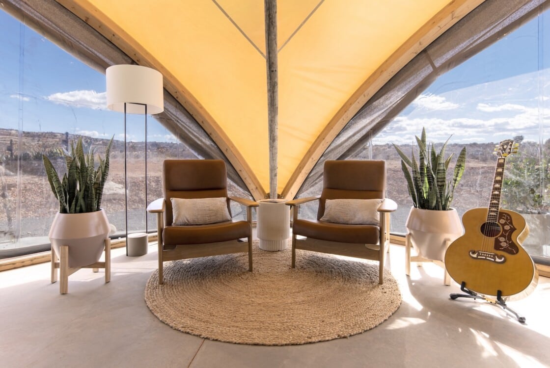 Interior of the lobby tent at under canvas with a small lounge area.